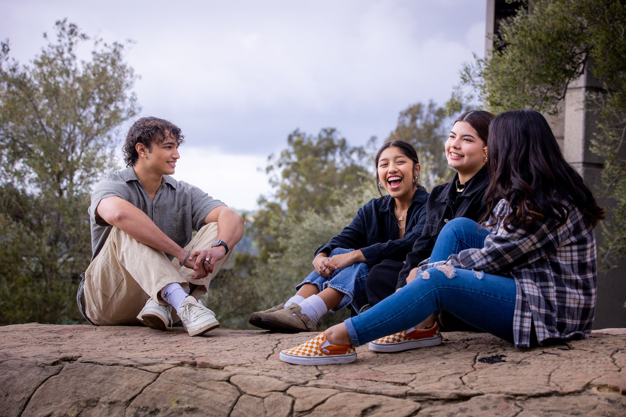 westmont students sitting on rock