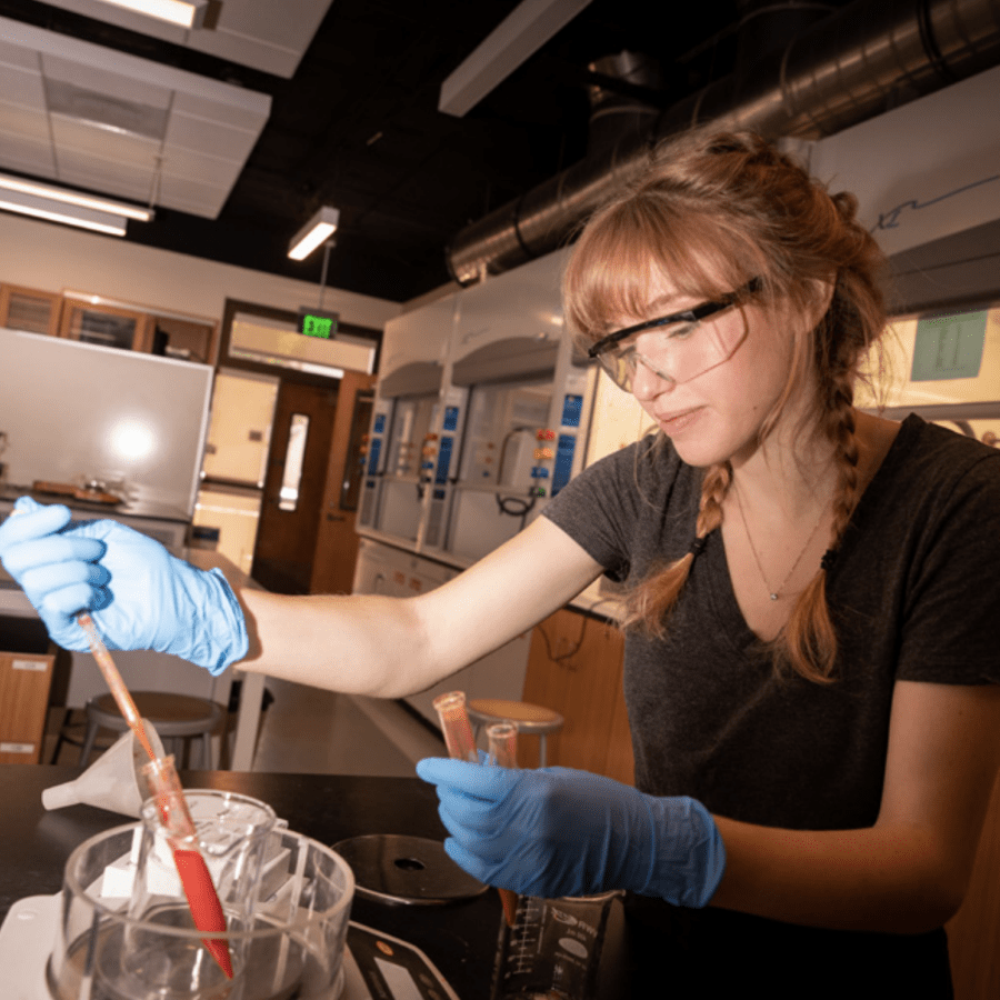 female chemistry student experimenting in lab