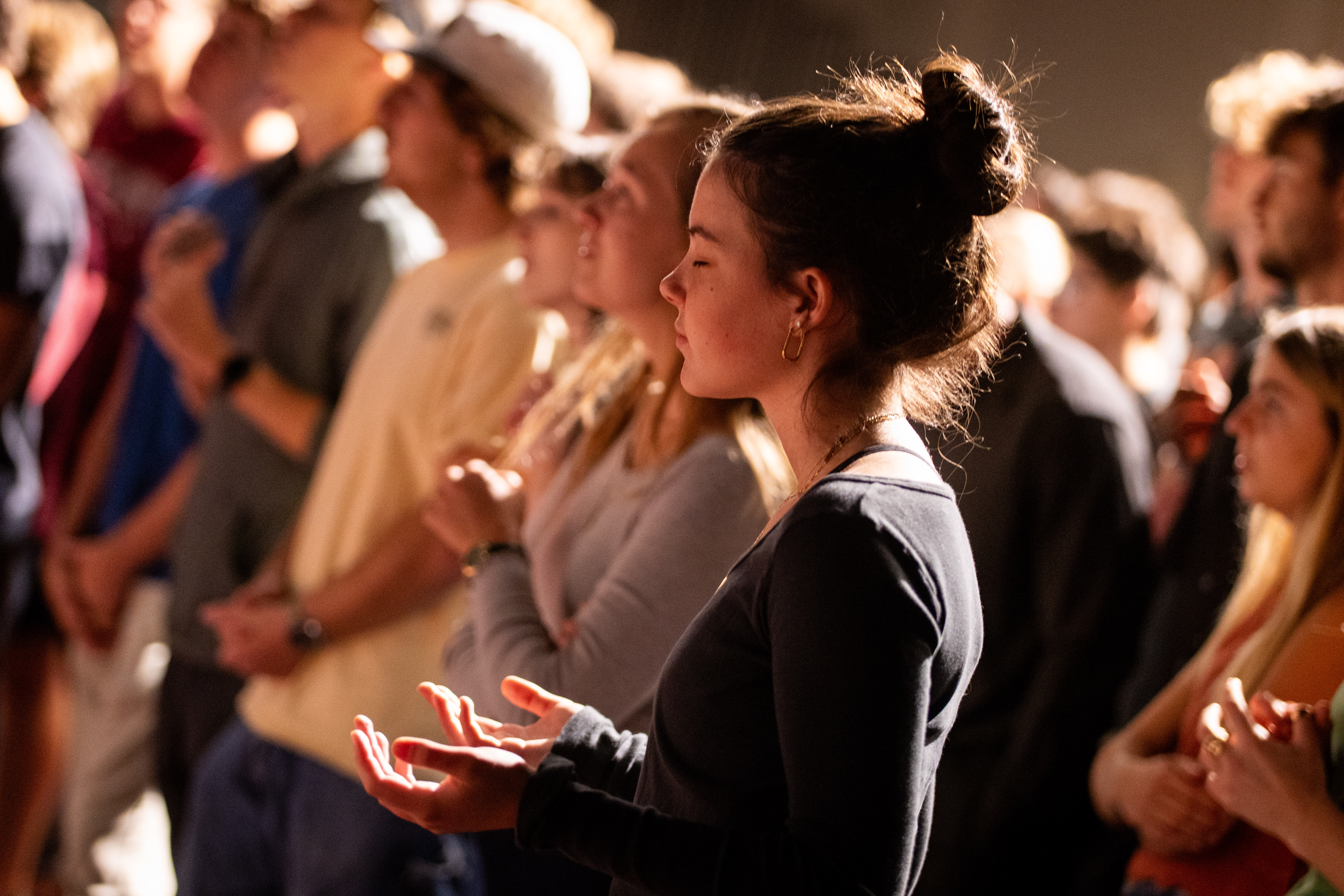 woman praying at chapel